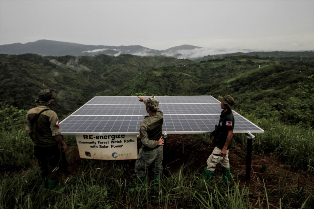 Dumagat forest rangers stand beside a solar micro-grid in Norzagaray, Bulacan, northern Philippines on 26 June 2018. Photo by Alanah Torralba